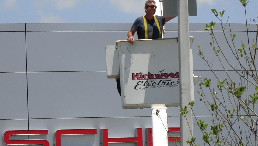 Bennett Rosenberger repairing lights at Porsche of Fort Myers, Florida.