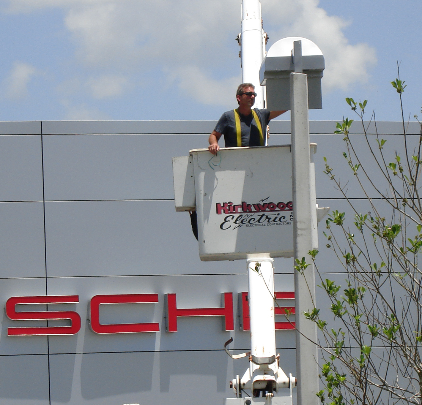 Bennett Rosenberger repairing lights at Porsche of Fort Myers, Florida.